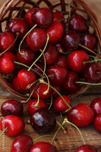 Ripe red cherries on a wooden table