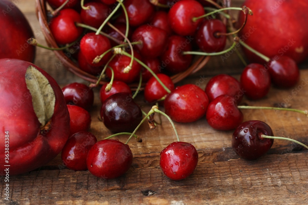 Juicy nectarines and cherries on the table Juicy nectarines and cherries on the table