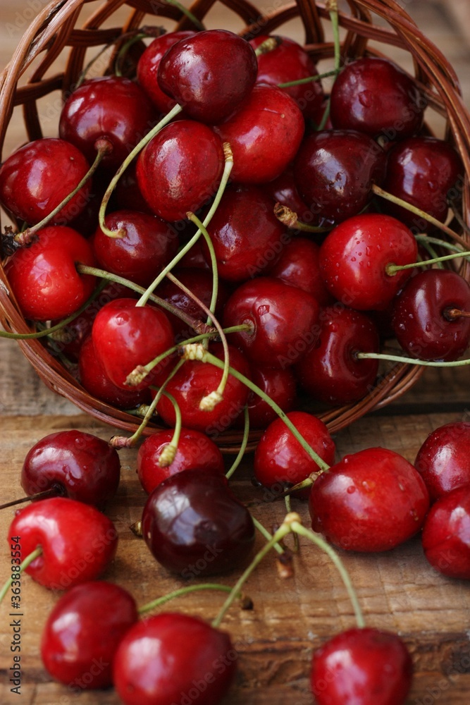 Ripe red cherries on a wooden table Ripe red cherries on a wooden table