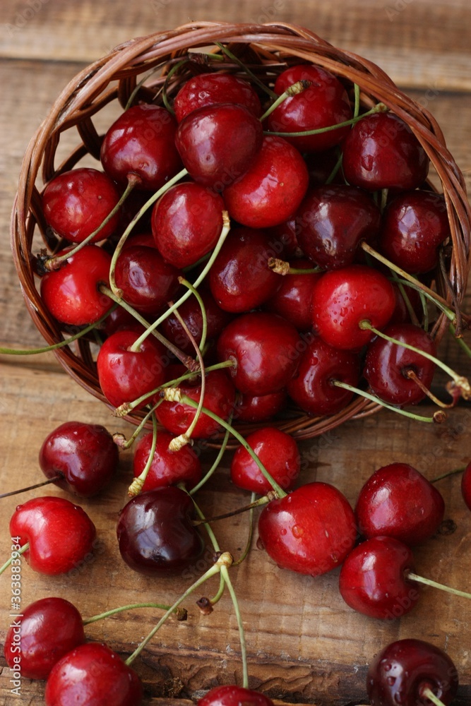 Ripe red cherries on a wooden table Ripe red cherries on a wooden table