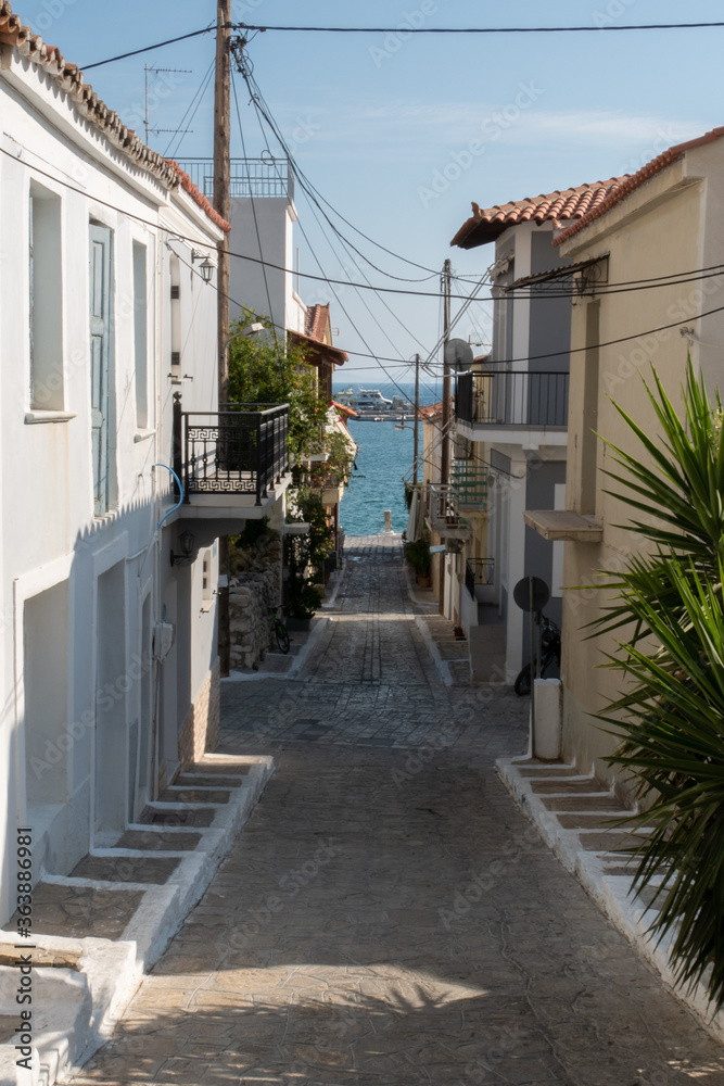 Small street with sea background and green plant. Dreamy with little balconys