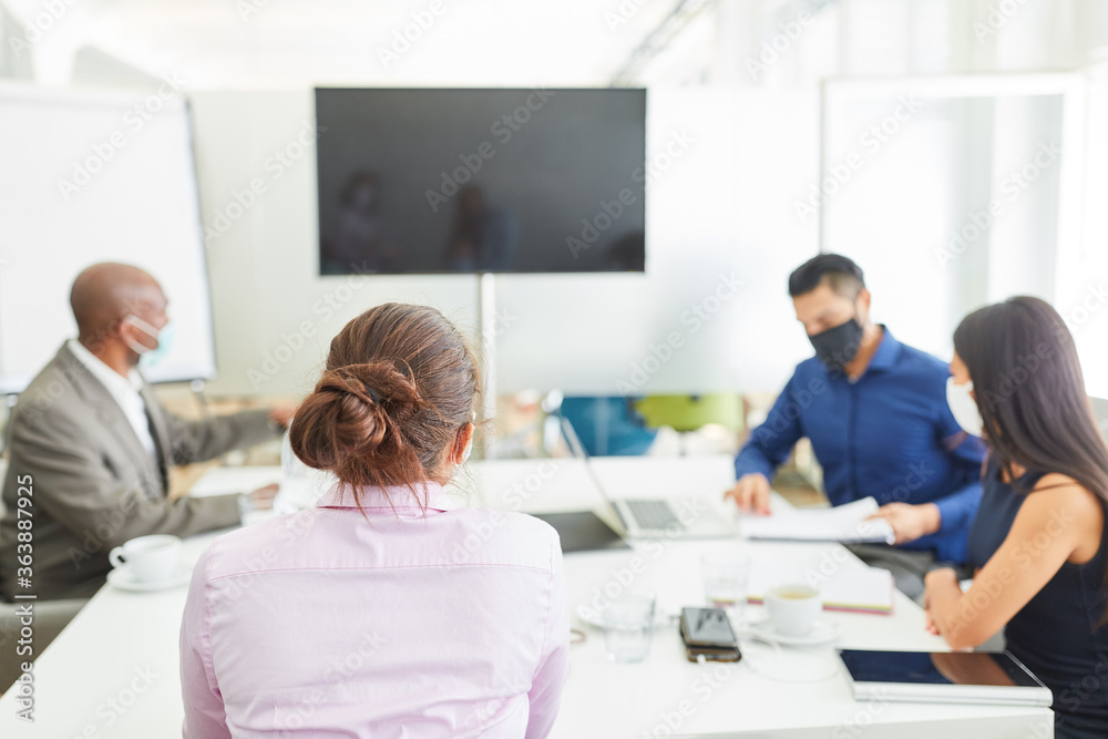 Business people with face mask in a meeting Business people with face mask in a meeting
