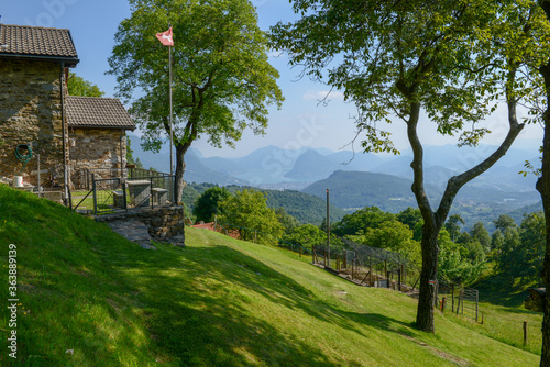 Fototapeta Naklejka Na Ścianę i Meble -  Landscape with rural house at Capriasca valley over Lugano on Switzerland