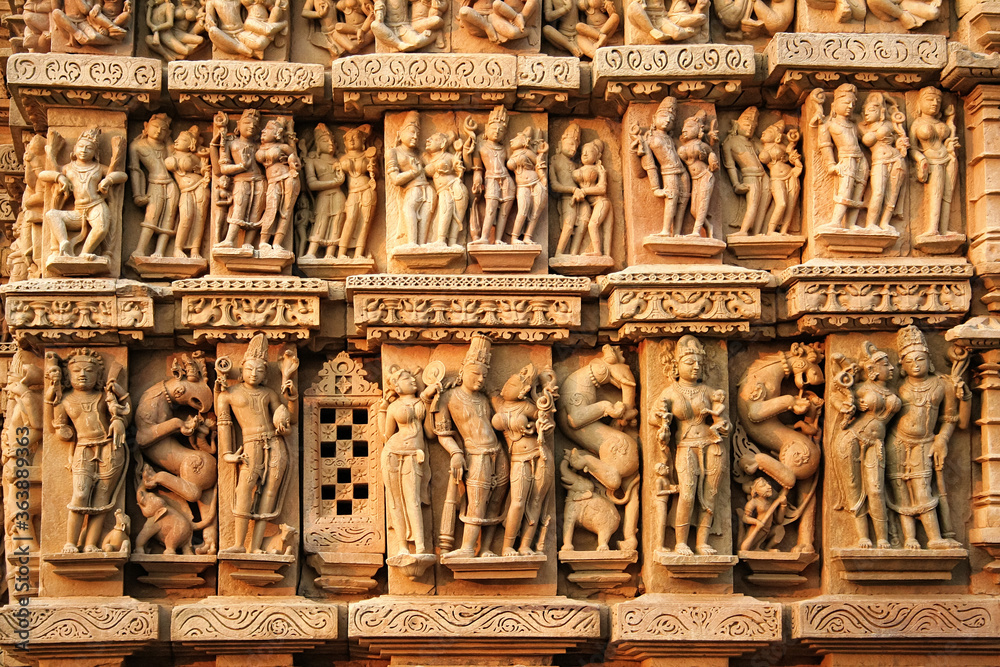 Close up of artful carved walls, Ancient reliefs at famous erotic temple in Khajuraho, Madhya Pradesh, India.