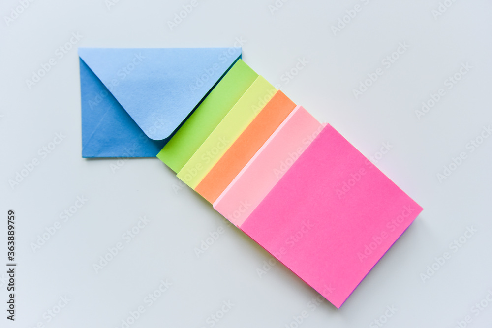 selective focus, blue envelope in the center with colored rectangles directed towards the corner selective focus, blue envelope in the center with colored rectangles directed towards the corner