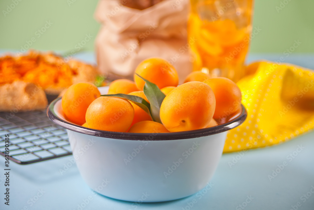 Apricot on the plate, galette tart pie with fresh ripe aprico and fresh summer drink Apricot on the plate, galette tart pie with fresh ripe aprico and fresh summer drink