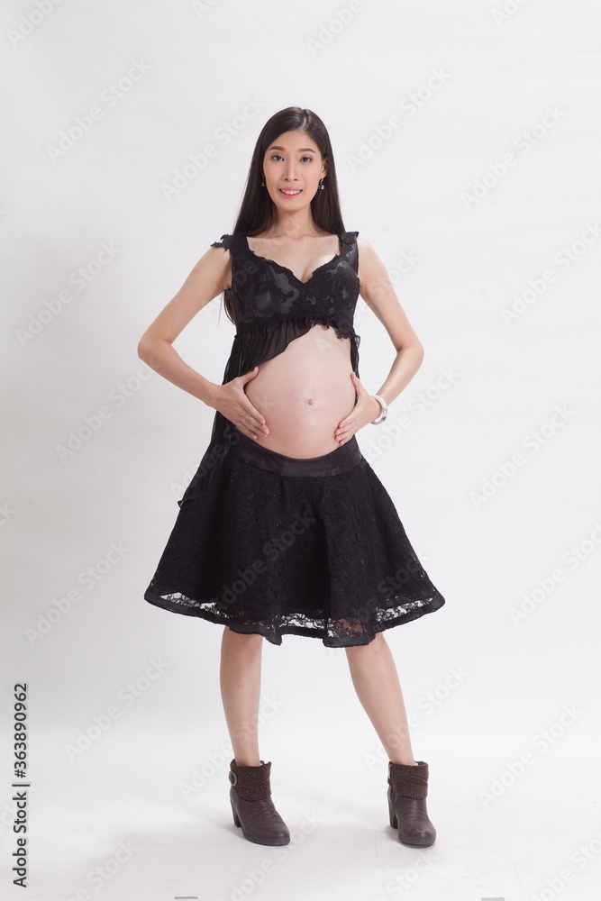 Fototapeta premium seven months pregnant on white background.