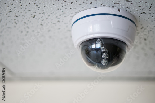 An example of mounting a spherical surveillance video camera in a suspended ceiling of an office building. CCTV