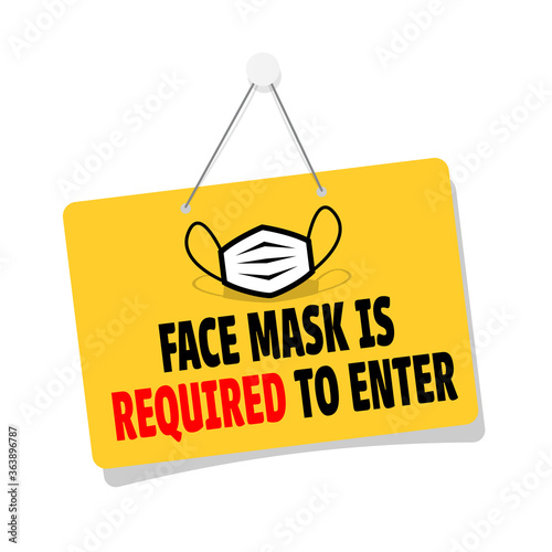 Face mask is required to enter door sign hanging	