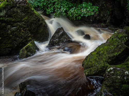 Upper waterfalls on Kirk Burn running through Campsie Glen just above Clachan of Campsie nr Lennoxtown Scotland. photo