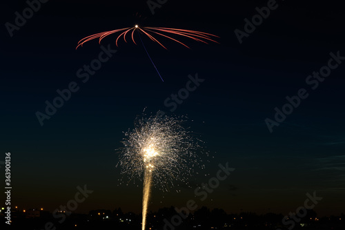 fireworks over city lights