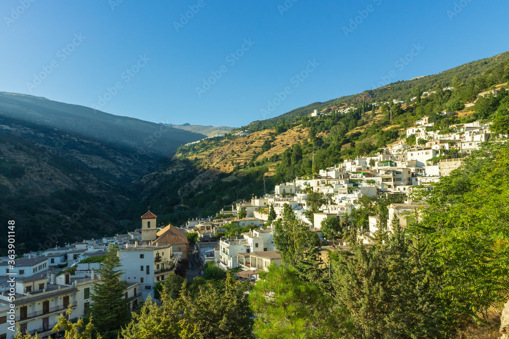 white villages on the side of a mountain