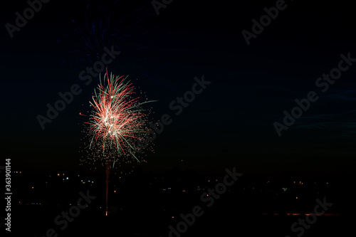 colorful fireworks over city lights