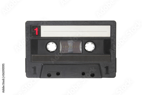 Black cassette isolated on white background. Audio tape macro photo