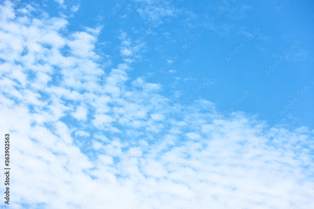 Blue sky with multitude of white clouds