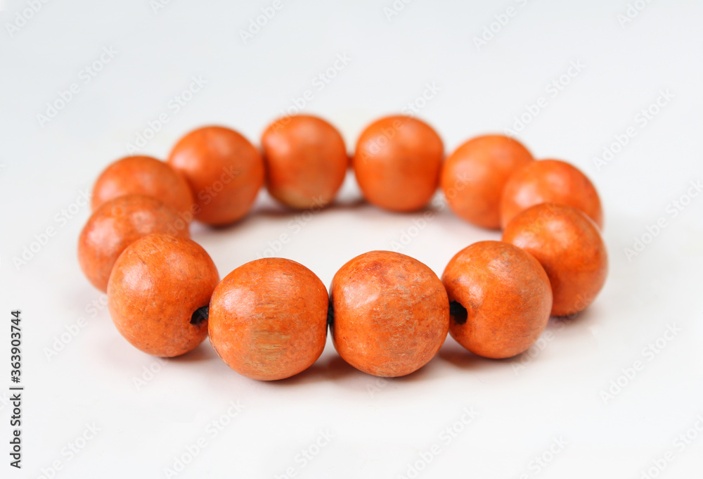 Wooden bracelet isolated on white background. Close up of simple bangle