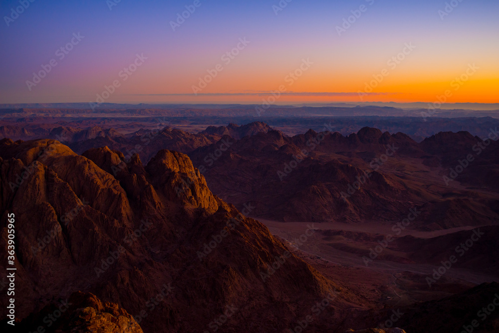 Colorful amazing Sunrise at Sinai Mountain, Beautiful dawn in Egypt, Beautiful view from the mountain, Egypt, Sinai, Mount Moses. View from road. Sunrise over Red sea. Colorful amazing Sunrise at Sinai Mountain, Beautiful dawn in Egypt, Beautiful view from the mountain, Egypt, Sinai, Mount Moses. View from road. Sunrise over Red sea.