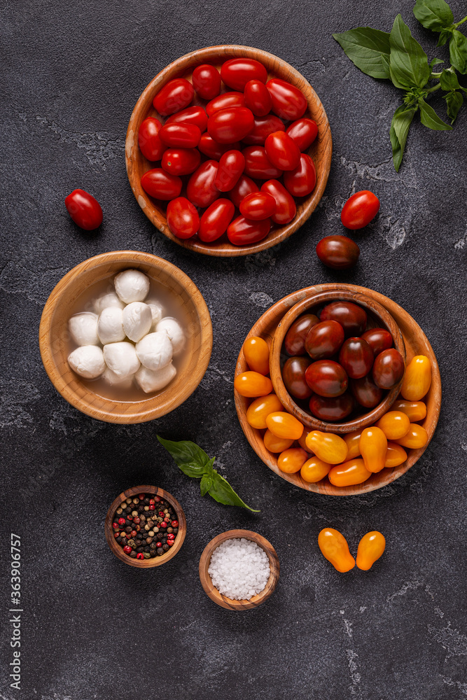 Ingredients for caprese salad: tomatoes, mozzarella and basil. Ingredients for caprese salad: tomatoes, mozzarella and basil.