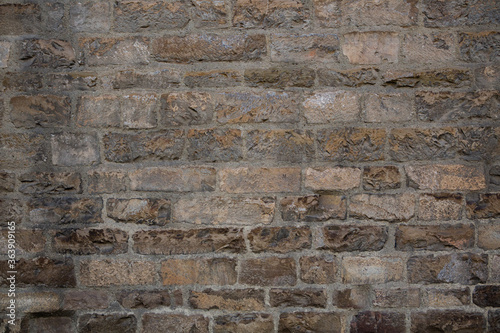 Antique brickwork wall. Masonry of ancient half-destroyed wall. Abstract texture or background.