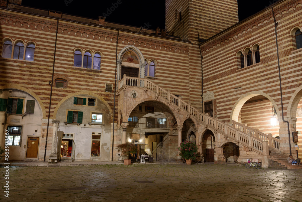 Night photo of Palazzo and Scala della Ragione, city of Verona, Italy.
