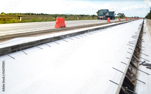 Geotextile under concrete road construction and concrete formwork with tie bar.