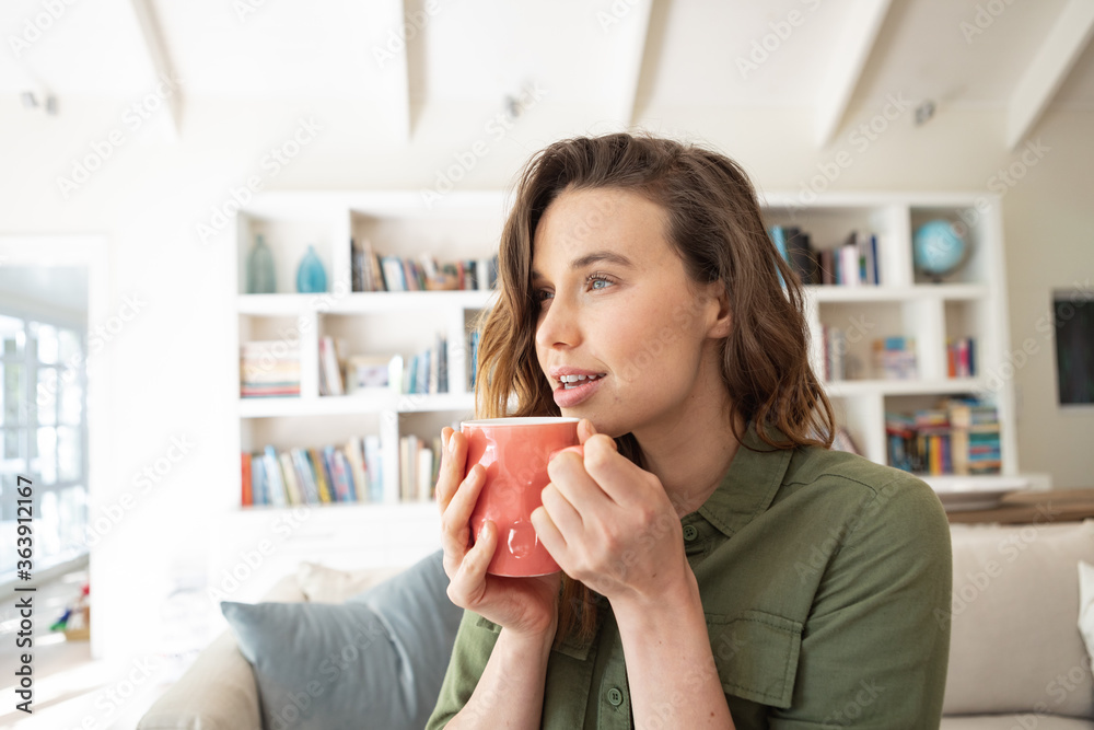Woman holding coffee cup at home Woman holding coffee cup at home
