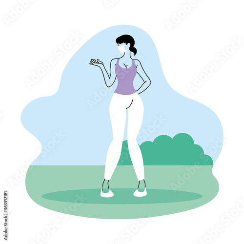 young woman with mask in the park