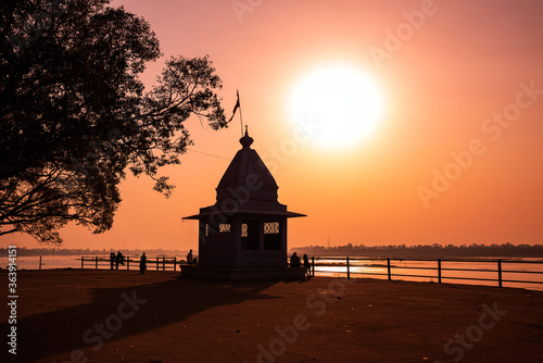 Dusk time at Cheepaner Ghat with holy Narmada river and temple, Madhya Pradesh, India.