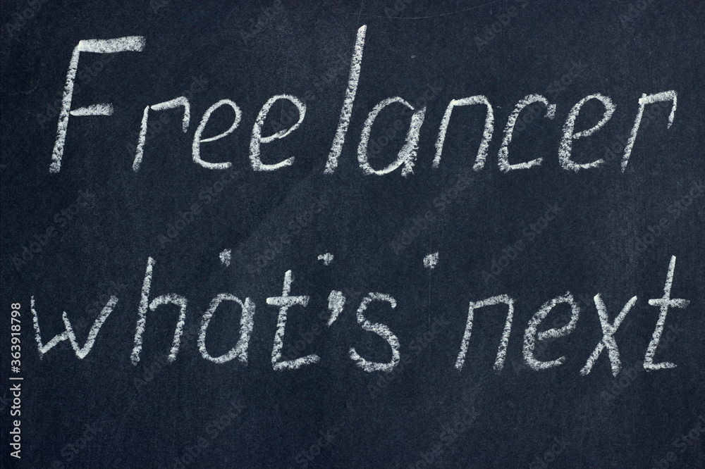 Fototapeta premium The inscription on the chalk board Freelancer, what's next. Refinement of plans