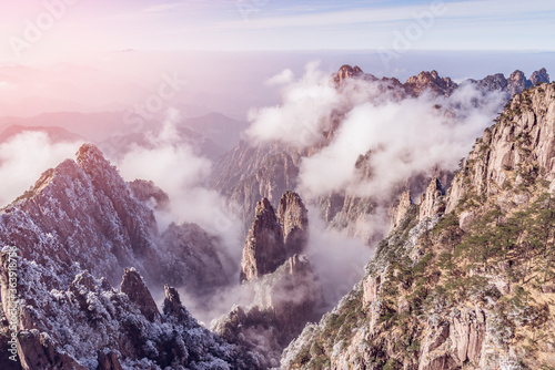 Clouds by the mountain peaks of Huangshan National park at sunrise time. © serjiob74