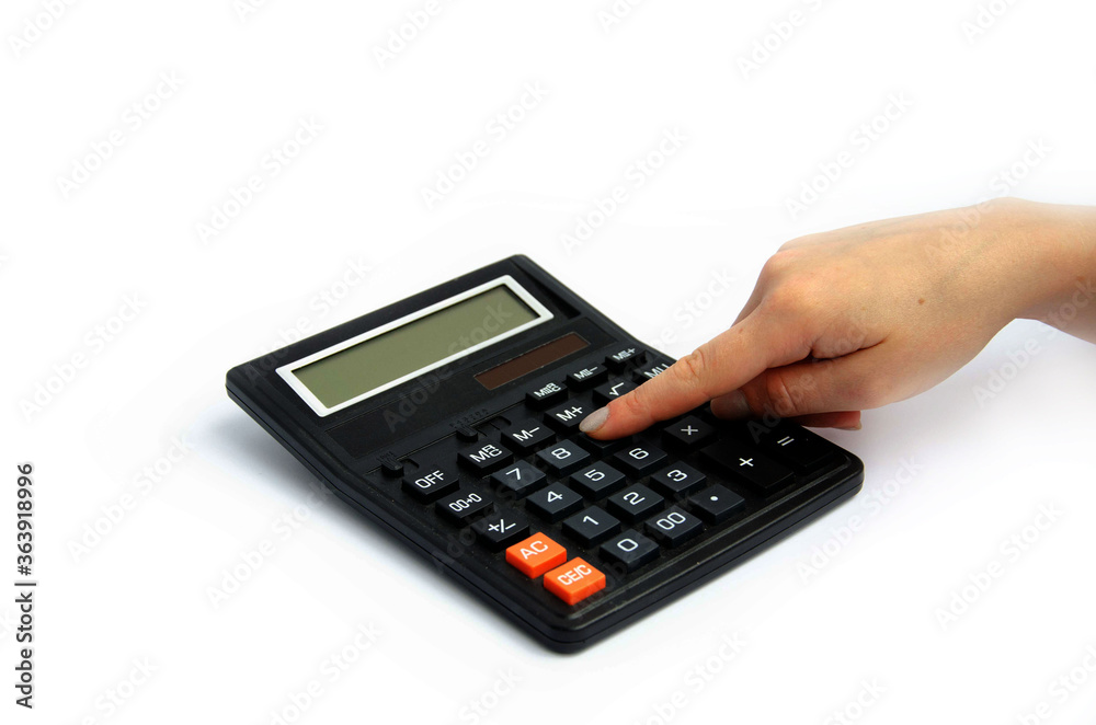 female female finger presses buttons on a large calculator white background
female female finger presses buttons on a large calculator white background