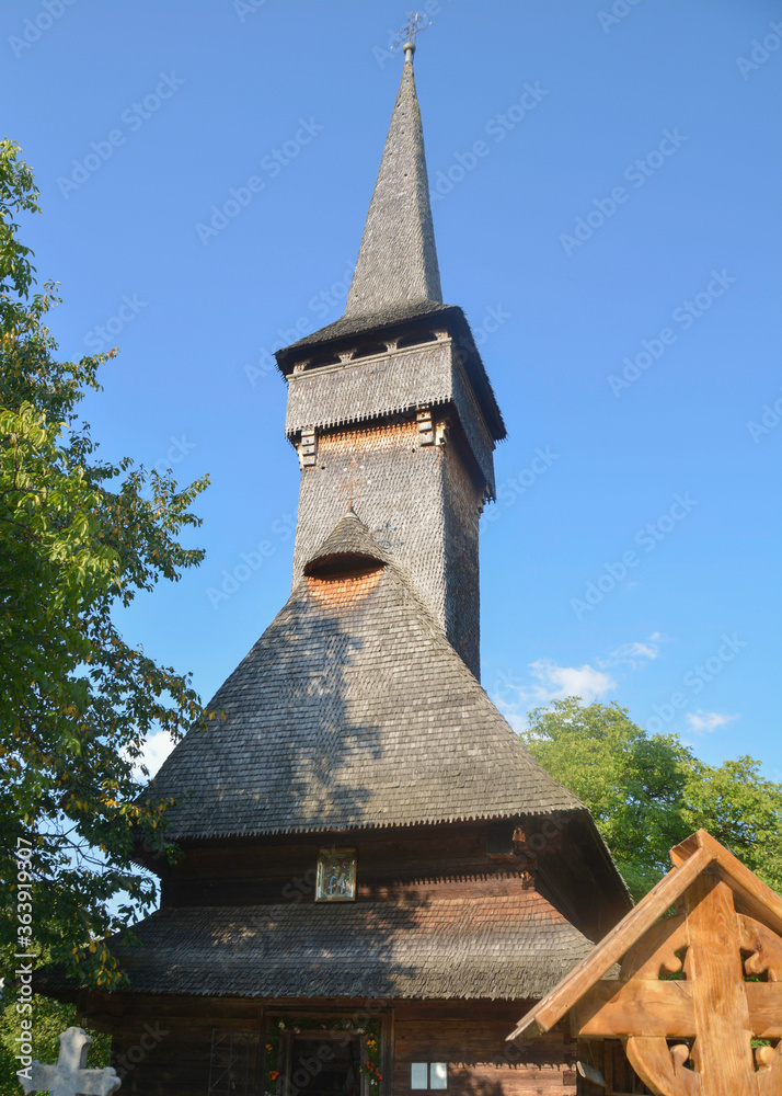 DESESTI, MARAMURES, ROMANIA, SUMMER 2018. Beautiful wooden orthodox church of Saint Parascheva or Desesti, Unesco World Heritage. With paintings inside by Alexandru Ponehalschi and Radu Munteanu