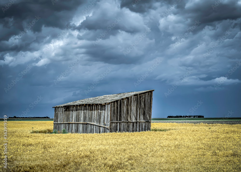Old, Abandoned Structures on the Great Plains as Storms Approach
