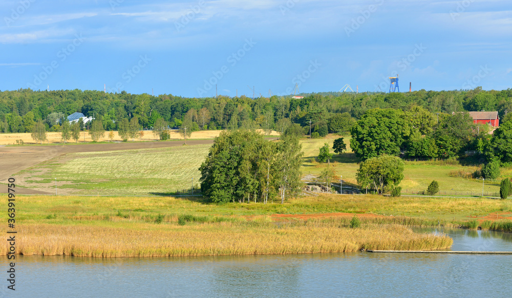 Summer landscape. Picturesque fields and pastures on shores of Baltic Sea. Turku Archipelago, Finland