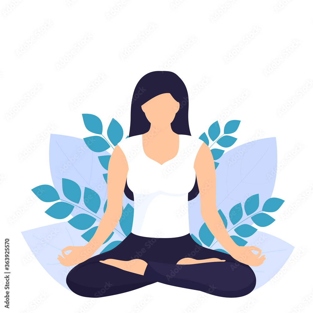 A young white woman with long dark hair sits in the lotus position. Yoga. Healthy lifestyle