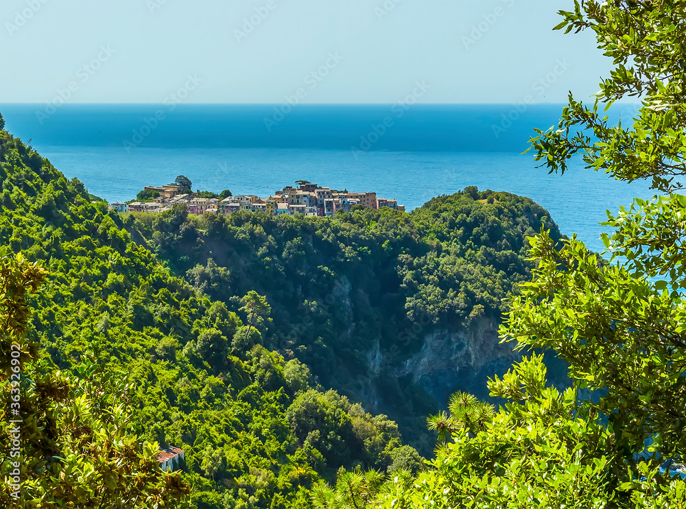 A view toward the picturesque cliff top village of Corniglia, Italy in the summertime