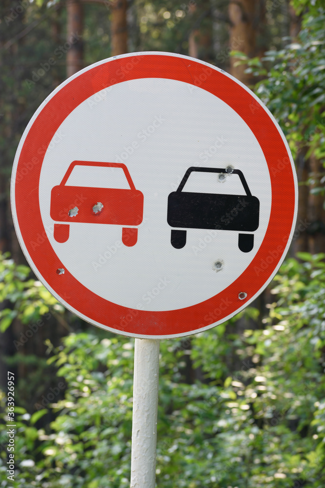 Road sign shot several times from hooligan motives close-up. Road sign shot several times from hooligan motives close-up.