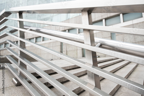 A close-up of the stainless steel handrail fence of the outdoor plaza.