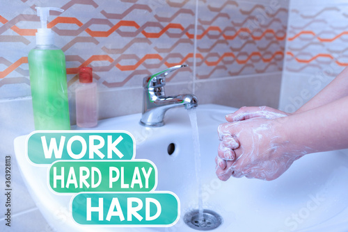 Conceptual hand writing showing Work Hard Play Hard. Concept meaning diligent in any activity Party at weekends Hardworking Handwashing procedures for minimizing bacterial growth photo