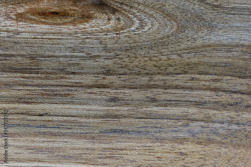 Background. Fragment of a wooden plate made of deciduous wood close-up.