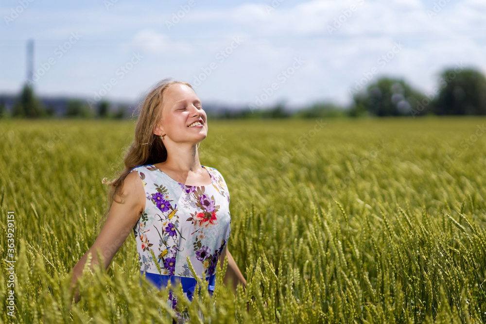 Portrait of young girl on a rye field. Shallow focus. Portrait of young girl on a rye field. Shallow focus.