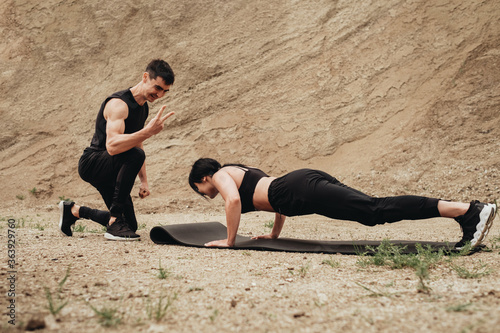 Two Athletes in Black Sportswear Training Together Open Air, Healthy Lifestyle and Outdoors Workout Concept