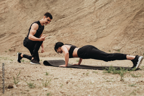 Two Athletes in Black Sportswear Training Together Open Air, Healthy Lifestyle and Outdoors Workout Concept