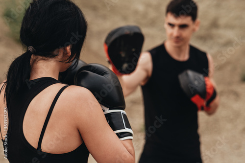 Two Boxers in Black Sportswear Training Together Open Air, Healthy Lifestyle and Outdoor Workout Concept © Romvy