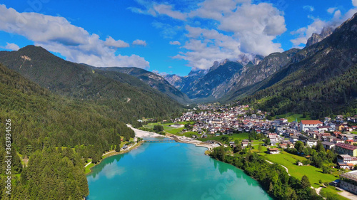 Aerial view of Auronzo Lake and Town in summertime  italian dolomites