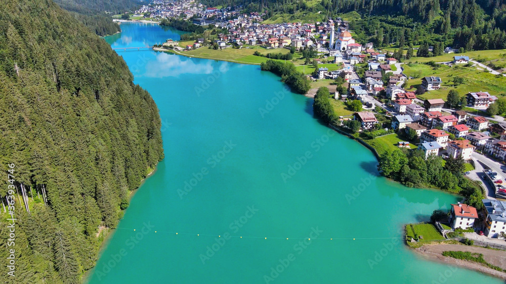 Fototapeta premium Alpin lake and dam in summertime, view from drone, Auronzo, italian dolomites