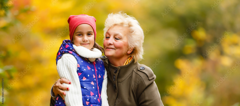 Senior citizen stroll in a park in autumn Senior citizen stroll in a park in autumn
