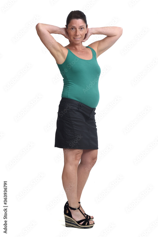 pregnant woman with a skirt on white background, hands neck