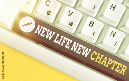 Text sign showing New Life New Chapter. Business photo text modification of brand or business Change opportunities Different colored keyboard key with accessories arranged on empty copy space photo