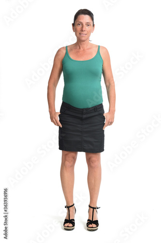 woman with a skirt and hands on pocket on white background,